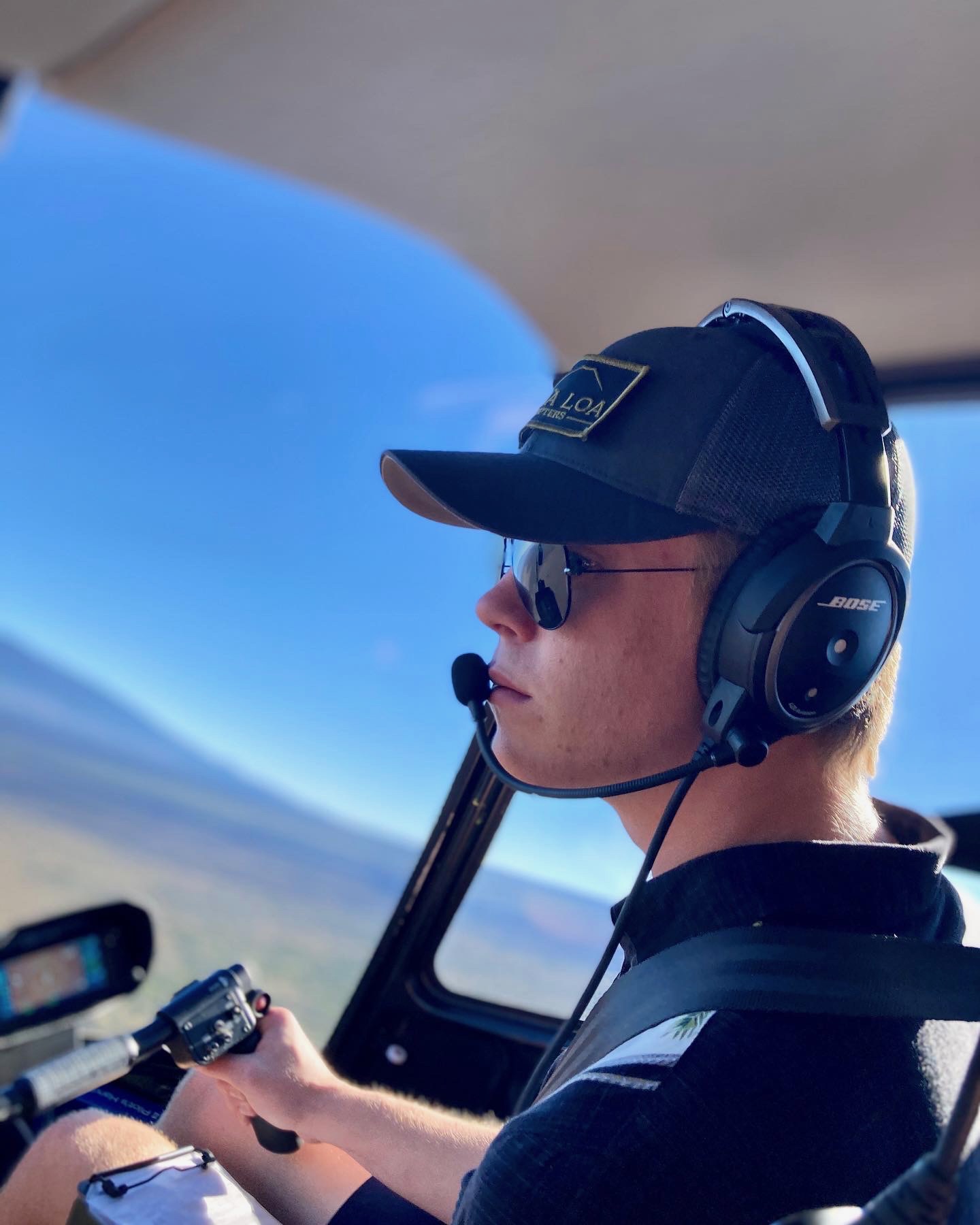 Jack Christensen Driving a helicopter.
