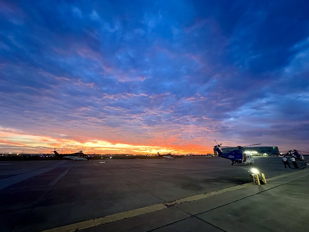 Helicopters on tarmac in the early morning