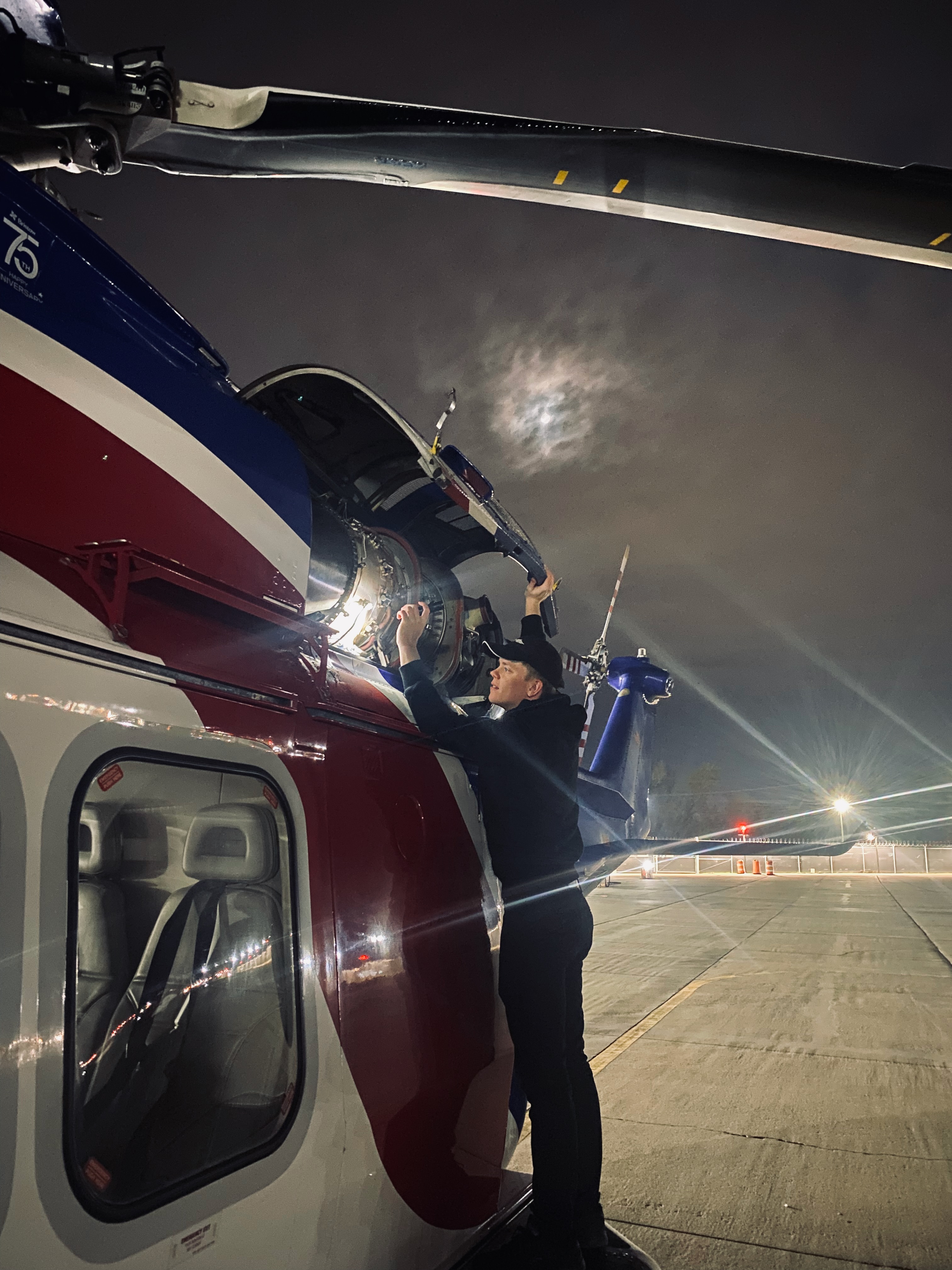 Jack Christensen with a helicopter at night.
