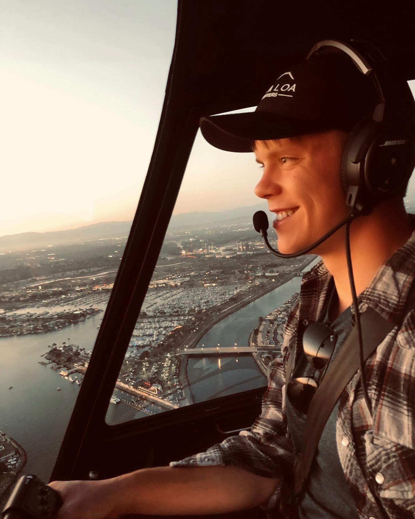 Jack Christensen driving a helicopter