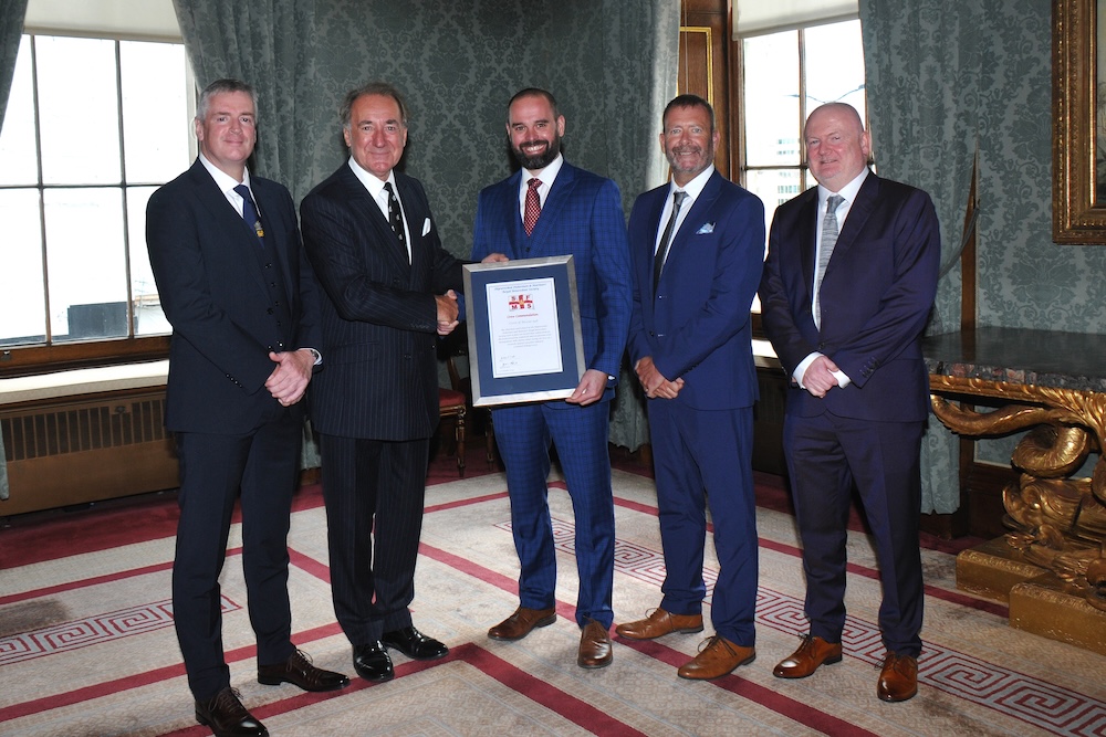 John Carrigan, Chris Whittington, Nam MacLeod and Michael Hennelly receive the 2024 Crew Commendation from Shipwrecked Mariners' Society President Admiral Sir George Zambellas (2nd from left)