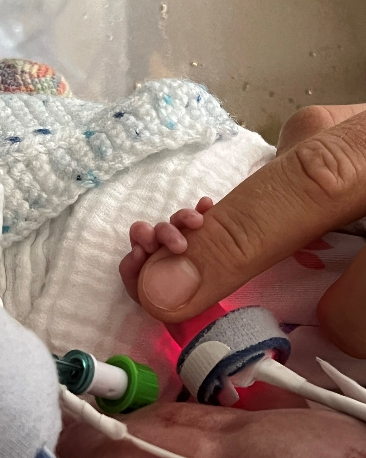 Baby Oscar holding a finger