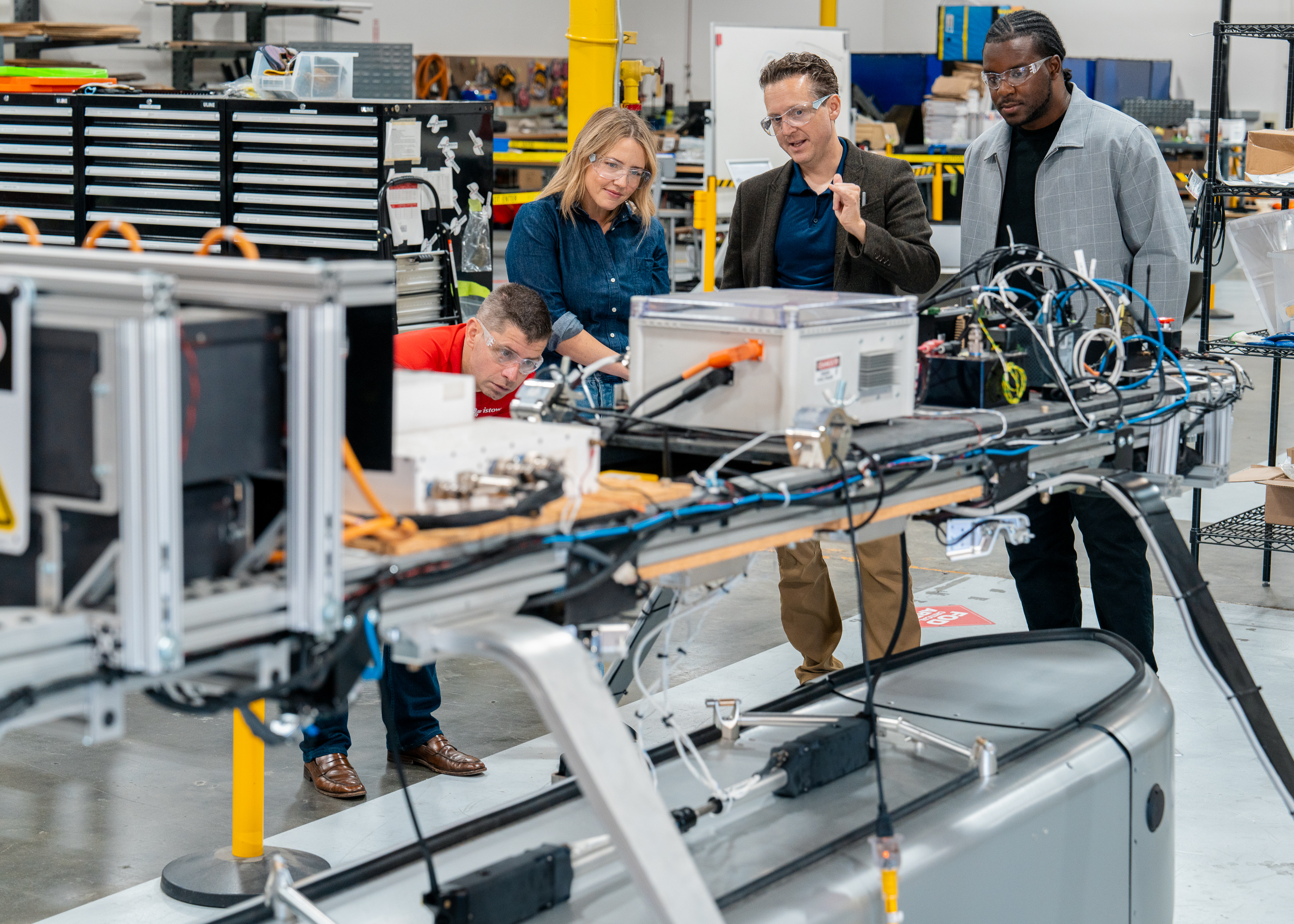 Mandy Nelson and others looking at aviation equipment